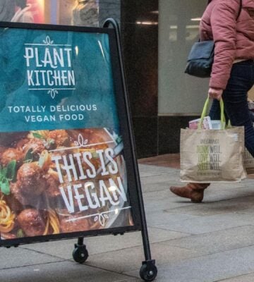 A sign outside M&S advertising its Plant Kitchen range reading "This is vegan"