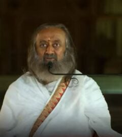 Photo shows Gurudev Sri Sri Ravi Shankar speaking on the Kindness With Amy podcast