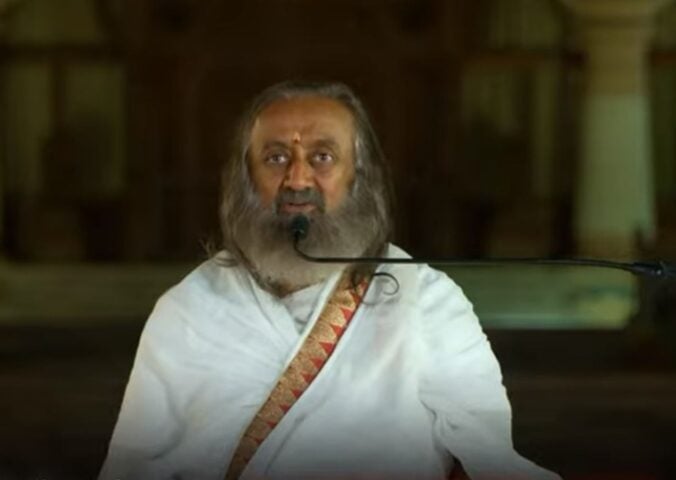 Photo shows Gurudev Sri Sri Ravi Shankar speaking on the Kindness With Amy podcast