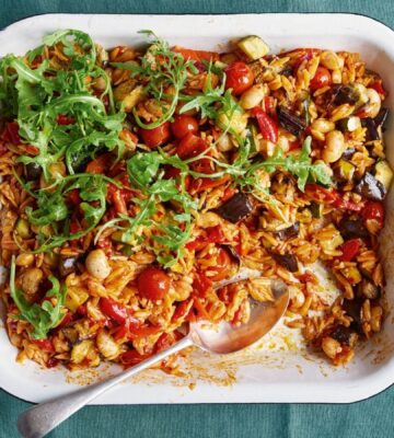 a picture of a tray bake with roasted pepper, thyme, and butter beans