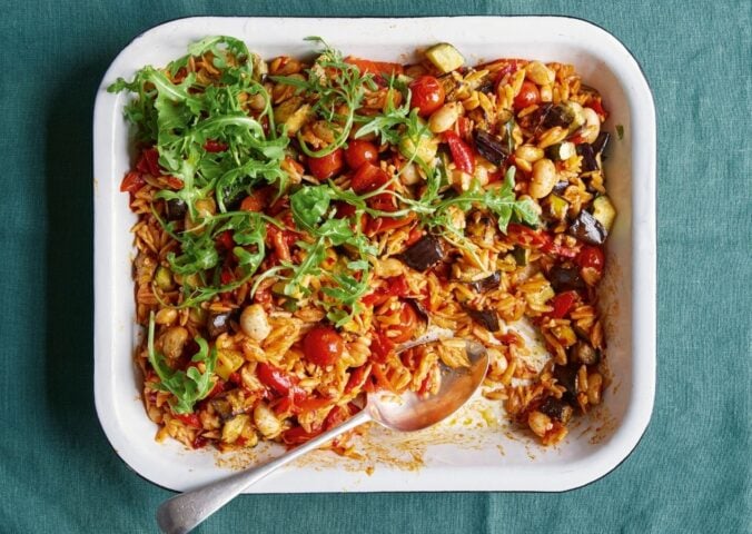 a picture of a tray bake with roasted pepper, thyme, and butter beans