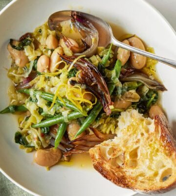 A bowl of roasted shallot and butter bean stew