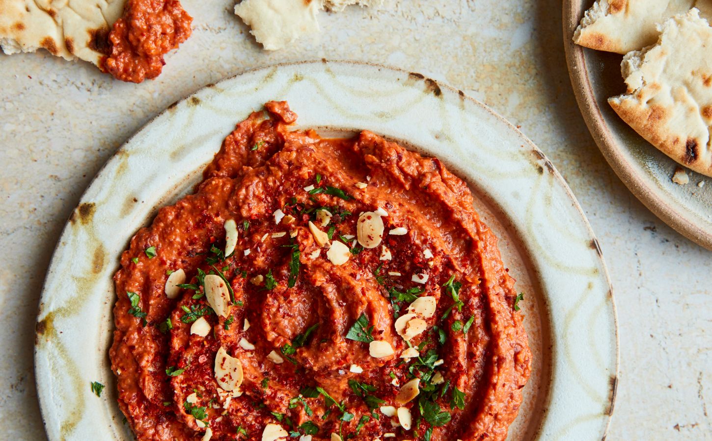 a picture of vibrant and smoky kidney bean dip made with canned red peppers and sun-dried tomatoes