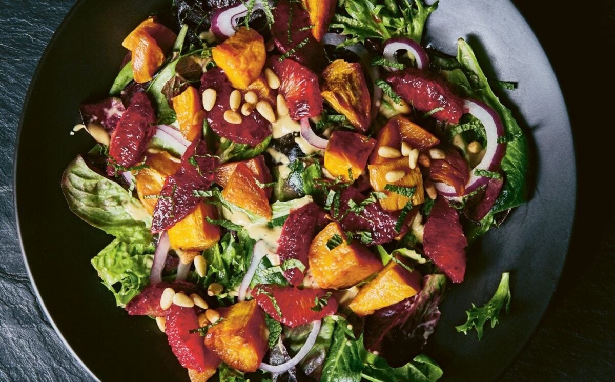 a picture of a vibrant sweet potato and blood orange salad with mustard vinaigrette