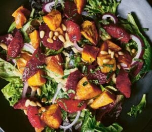 a picture of a vibrant sweet potato and blood orange salad with mustard vinaigrette