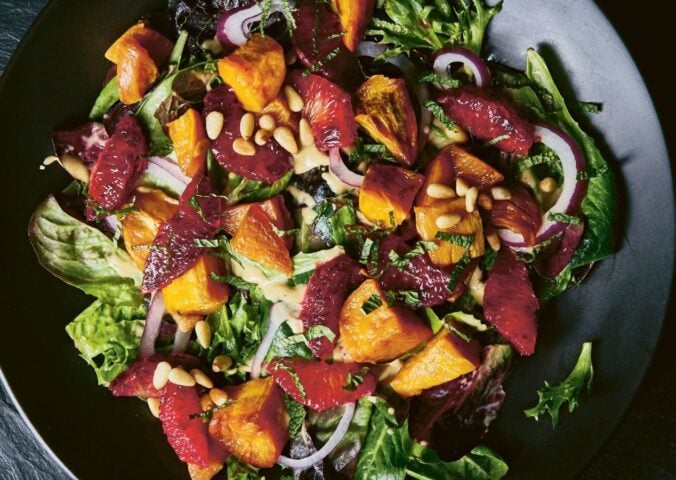 a picture of a vibrant sweet potato and blood orange salad with mustard vinaigrette