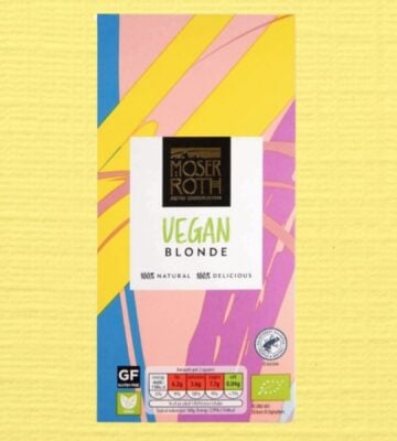 The Moser Roth vegan blonde Aldi chocolate bar in front of a pale yellow background