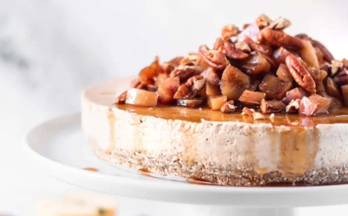 a picture of a pink apple and salted caramel cheesecake topped with maple and pecans