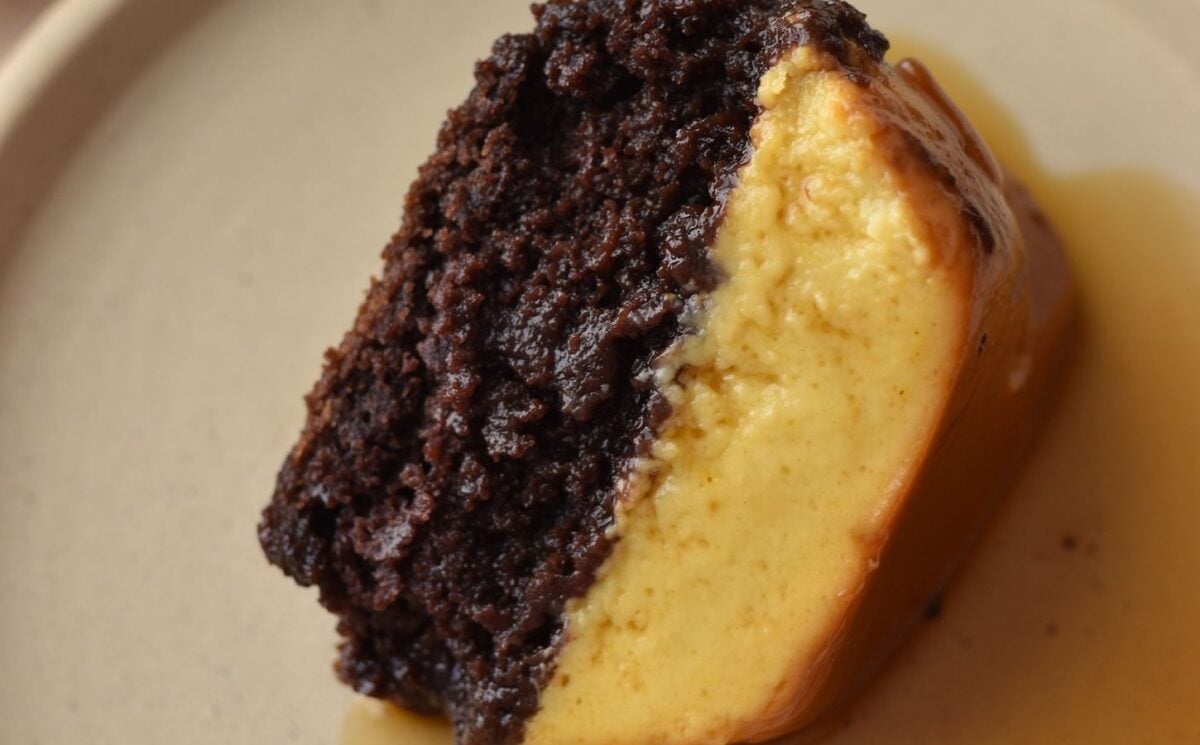 A picture of a slice of vegan chocoflan made with silken tofu and box cake mix