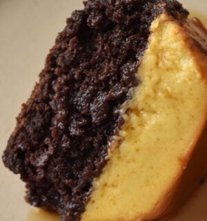 A picture of a slice of vegan chocoflan made with silken tofu and box cake mix