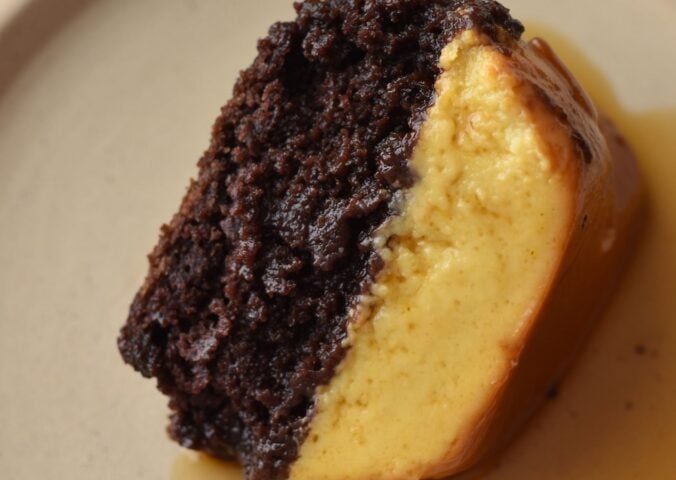 A picture of a slice of vegan chocoflan made with silken tofu and box cake mix