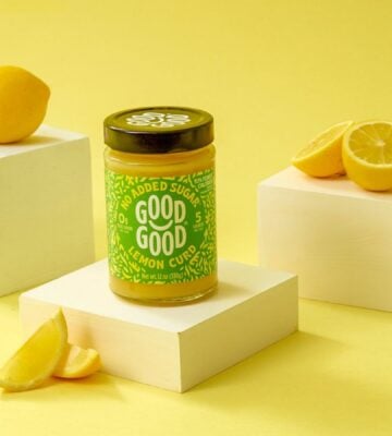 Photo shows GOOD GOOD's vegan lemon curd product, surrounded by lemons, against a yellow background