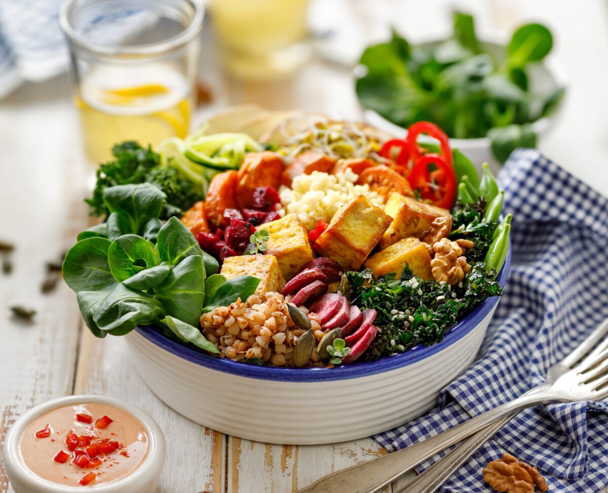 A buddha bowl filled with a range of different plant proteins