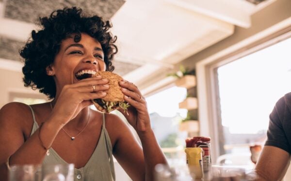 Woman eats burger