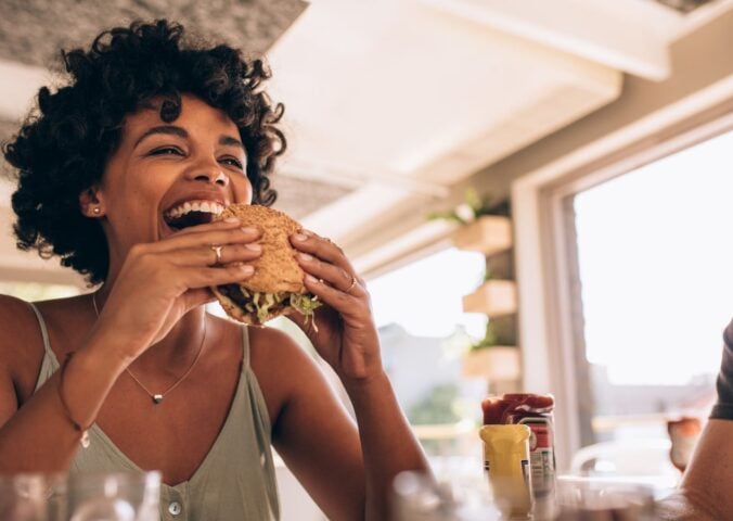 Woman eats burger