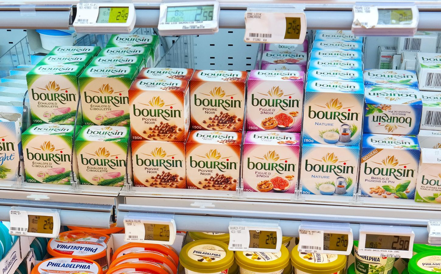 Photo shows a selection of Bel Group's Boursin cheese on a refrigerated supermarket shelf