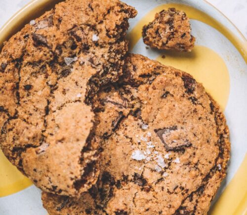 a picture of a chocolate chunk cookie topped with sea salt