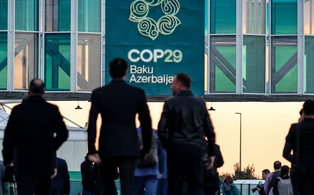 Men walking into the COP29 conference in Baku, Azerbaijan