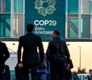 Men walking into the COP29 conference in Baku, Azerbaijan