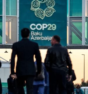 Men walking into the COP29 conference in Baku, Azerbaijan