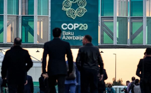 Men walking into the COP29 conference in Baku, Azerbaijan