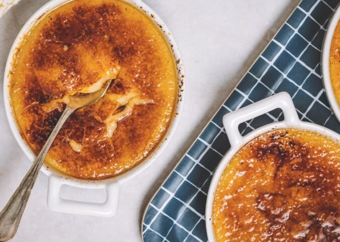 a picture of freshly-made vegan creme brulees topped with torched sugar