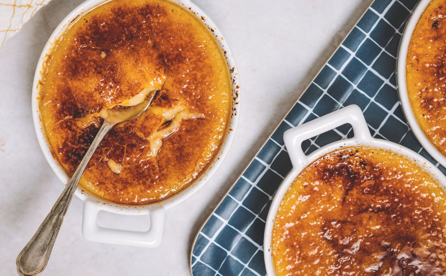 a picture of freshly-made vegan creme brulees topped with torched sugar