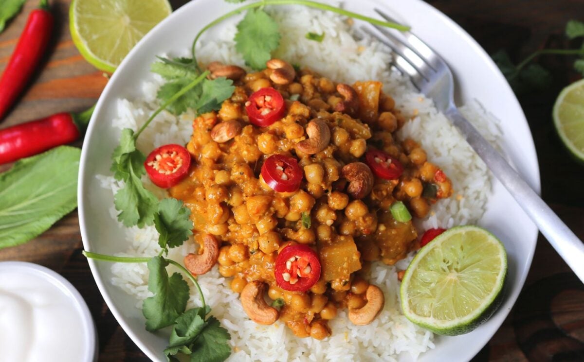 a bowl of balinese summer curry made with cashews, chickpeas, Quorn, and mango, a high protein vegan curry recipe