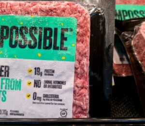 Some Impossible Foods burgers on a supermarket shelf