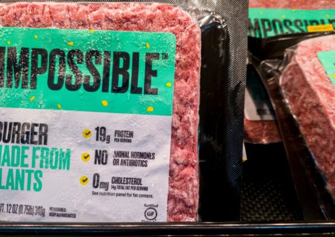 Some Impossible Foods burgers on a supermarket shelf