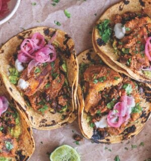 a picture of plantain and black bean tacos made with charred poblano sauce