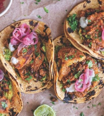 a picture of plantain and black bean tacos made with charred poblano sauce