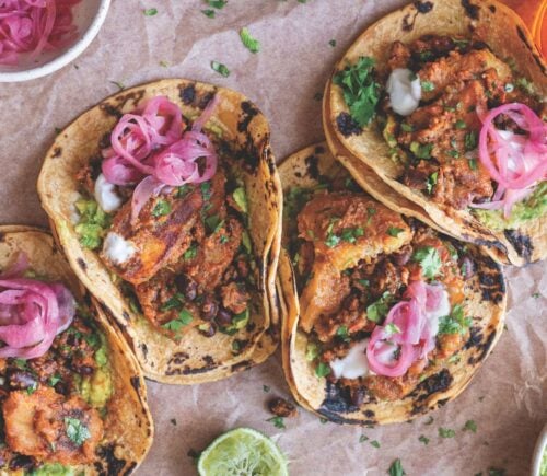 a picture of plantain and black bean tacos made with charred poblano sauce