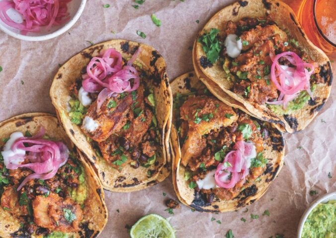 a picture of plantain and black bean tacos made with charred poblano sauce