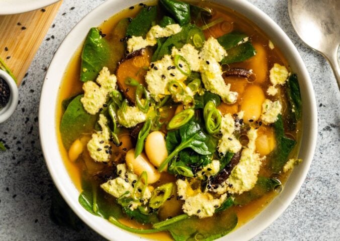 Two bowls of miso butter bean soup, a warming vegan soup recipe