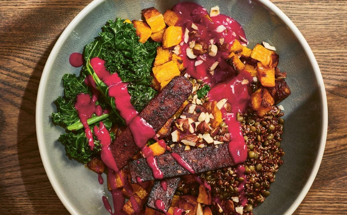 a picture of an autumn everything bowl with yogurt beet sauce for a November vegan dinner idea