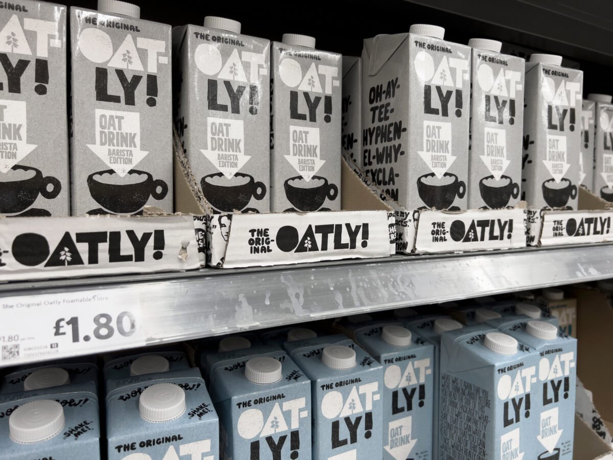 A selection of Oatly cartons at a supermarket