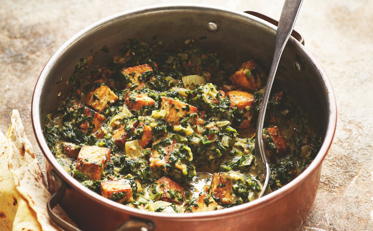 a pot of vegan palak paneer made with tofu and spinach