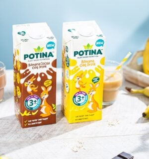 Photo shows both flavors of the new Potina drink on a table with a glass and several bananas