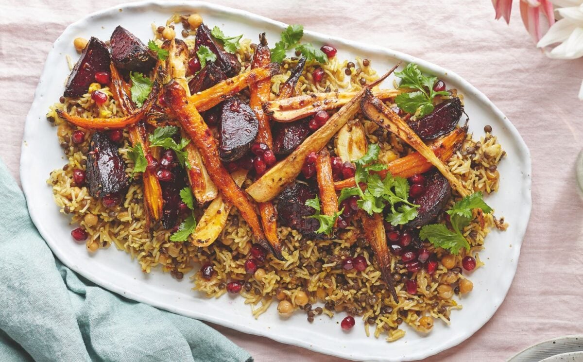 a platter of rice and lentils with tahini roasted root veg served with a zesty dressing