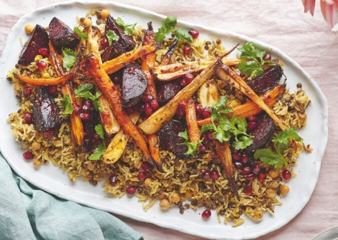 a platter of rice and lentils with tahini roasted root veg served with a zesty dressing