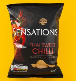 A packet of Thai Sweet Chilli Sensations in front of a yellow background