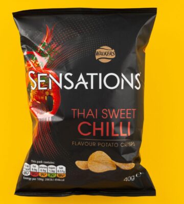 A packet of Thai Sweet Chilli Sensations in front of a yellow background