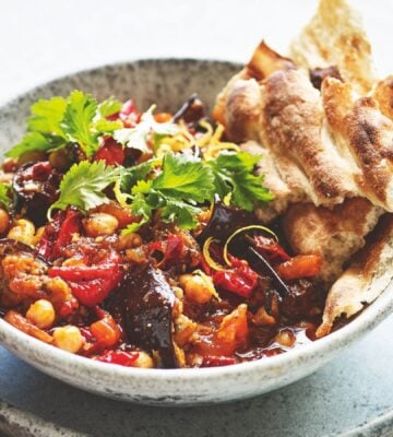 a bowl of smoky aubergine with tomato and chickpeas made with chipotle chilies