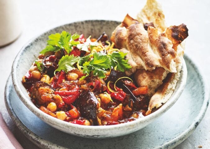 a bowl of smoky aubergine with tomato and chickpeas made with chipotle chilies