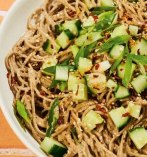 a bowl of soba noodles with cucumber and a miso pecan butter