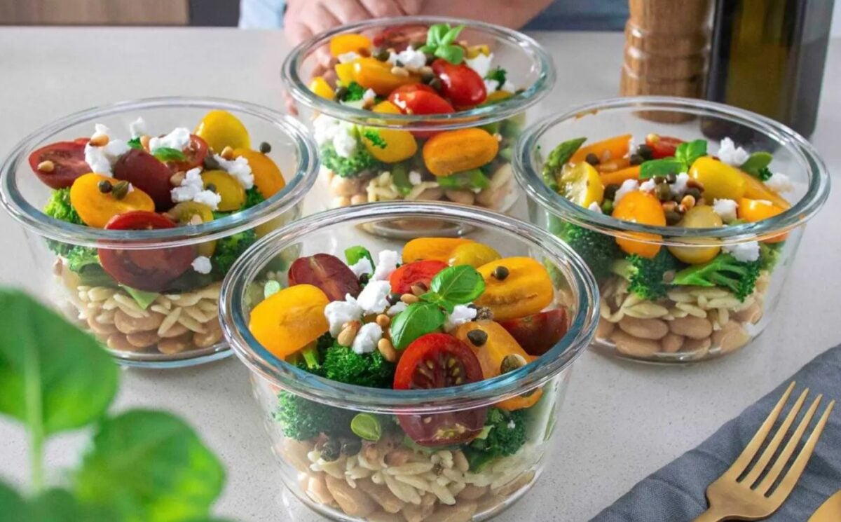 Jars of pesto, bean, and orzo salad, a vegan office packed lunch idea