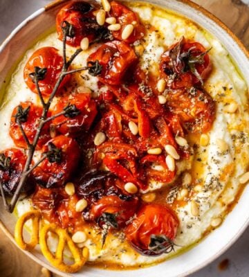 A vegan whipped feta dish with slow-roasted tomatoes