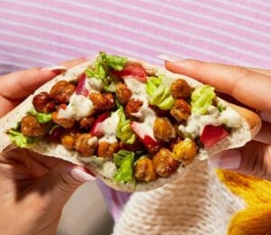 a picture of one of the portable and vegan Caesar chickpea pitta pockets