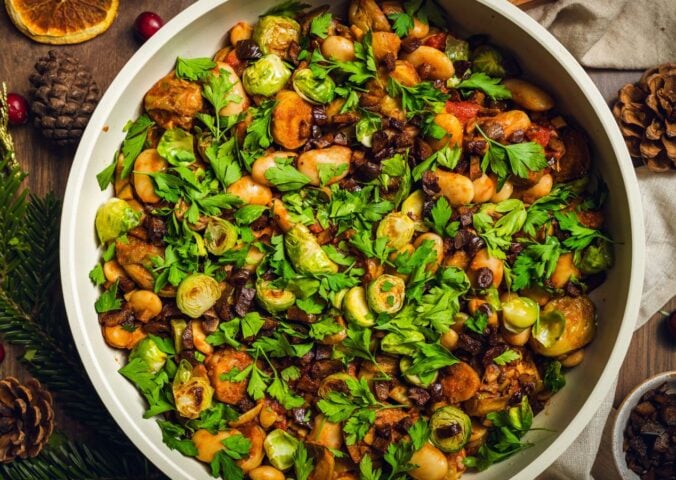 a bowl of chopped, caramelized sprouts with butter beans and chestnuts